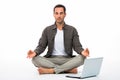 Man in yoga position with computer