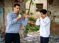 Man and young boy in an abandoned house Royalty Free Stock Photo