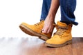 Man zips up his winter nubuck boots. Mens winter leather shoes Royalty Free Stock Photo