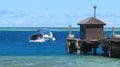 Observation viewing boat next to the pier, Mana island Fiji Royalty Free Stock Photo