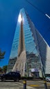 manacar tower triangular building in mexico city afternoon with sun reflection in mirror shot from the street