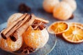 Manadarines, cinnamon sticks, anise and dried oranges on a wood