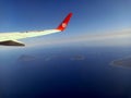 Lion air aircraft on air flying above Manado background islands of Bunaken marine park Royalty Free Stock Photo