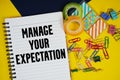 Manage Your Expectation text with stationery on yellow background Royalty Free Stock Photo