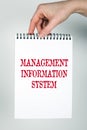 MANAGEMENT INFORMATION SYSTEM concept. Note book with text