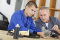 Manager with apprentice holding bearing Royalty Free Stock Photo