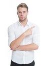 Manager or assistant help find direction. Pointing direction. Man shop assistant pointing index finger isolated on white Royalty Free Stock Photo