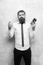 Manager or bearded man compare mobile phone and smartphone Royalty Free Stock Photo