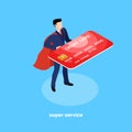 Manager in a business suit and in a cloak of a super hero with a credit card in his hands