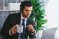 Manager of call center operator office sitting on his desk with coffee. fervent Royalty Free Stock Photo