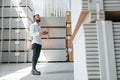 Manager checking the data by using tablet. Storage worker is in the warehouse with bunch of products Royalty Free Stock Photo