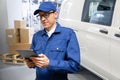 Manager with a digital tablet on the background of van. Fleet and warehouse management.. Royalty Free Stock Photo