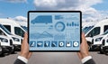 Manager with a digital tablet on the background of vans. Fleet management Royalty Free Stock Photo