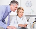 Manager and doctor reading news Royalty Free Stock Photo