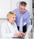 Manager and doctor reading news Royalty Free Stock Photo