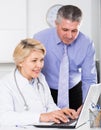 Manager and doctor reading news Royalty Free Stock Photo