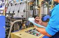 Manager engineer checking automated production line Plastic bag