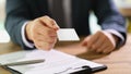 Manager handing out business card to client at work in office closeup