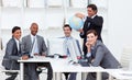 Manager holding a globe with his team Royalty Free Stock Photo