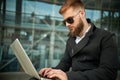 Manager holding laptop, Out of office work, young businessman using computer Royalty Free Stock Photo