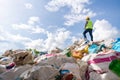 A manager holds a tablet on top of a pile of recycling bottles at recycling plant. Recycle waste business concept. Recycle waste Royalty Free Stock Photo