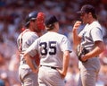 Manager Joe Morgan, catcher Rich Gedman and pitcher Roger Clemens meet at the mound. Royalty Free Stock Photo