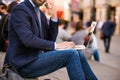 Manager with laptop and smart phone, Piccadilly Circus, London Royalty Free Stock Photo