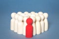 A manager or leader standing out infront of a group of people Royalty Free Stock Photo