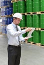 Manager in a logistic company work in a warehouse with chemicals Royalty Free Stock Photo