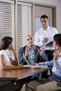 Manager meeting with office workers, directing Royalty Free Stock Photo