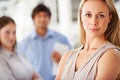 Manager, serious and portrait of business woman with team for leadership, confidence and pride. Corporate office Royalty Free Stock Photo