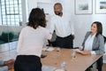 Manager shaking hands with an employee during a meeting Royalty Free Stock Photo