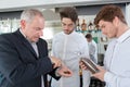 Manager showing coffee beans to students Royalty Free Stock Photo