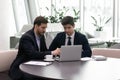 Manager showing to client presentation on laptop during meeting Royalty Free Stock Photo