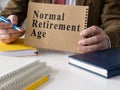 Manager shows Normal Retirement Age NRA data. Royalty Free Stock Photo