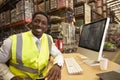 Manager in the on-site office of a warehouse looks to camera Royalty Free Stock Photo