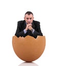 Man sitting into a egg Royalty Free Stock Photo