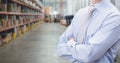 Manager standing with arms crossed in warehouse Royalty Free Stock Photo