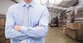 Manager standing with arms crossed in warehouse Royalty Free Stock Photo