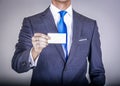 Manager in suit holding a business card Royalty Free Stock Photo