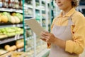 Manager of supermarket using tablet pc Royalty Free Stock Photo