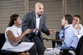 Manager talking with group of office workers Royalty Free Stock Photo