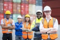 Manager and teamwork standing in container depo company area Royalty Free Stock Photo