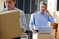 Manager Using Headset In Distribution Warehouse Royalty Free Stock Photo