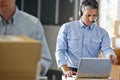 Manager Using Headset In Distribution Warehouse Royalty Free Stock Photo