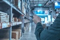 Manager using smart tablet monitor process Analyzes, check and control product in stock warehouse, modern software, futuristic