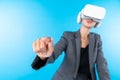 Manager wearing VR headset and standing while pointing hologram. Contraption. Royalty Free Stock Photo