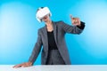 Manager wearing VR headset and standing while pointing hologram. Contraption. Royalty Free Stock Photo