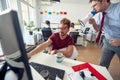 A manager is yelling on a sleepy employee through a megaphone at work in the office. Employees, job, office Royalty Free Stock Photo