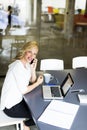 Manageress with mobile phone in office Royalty Free Stock Photo